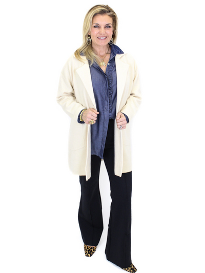 Collared Trench Cardigan - Cream front view with a denim shirt and black pants.