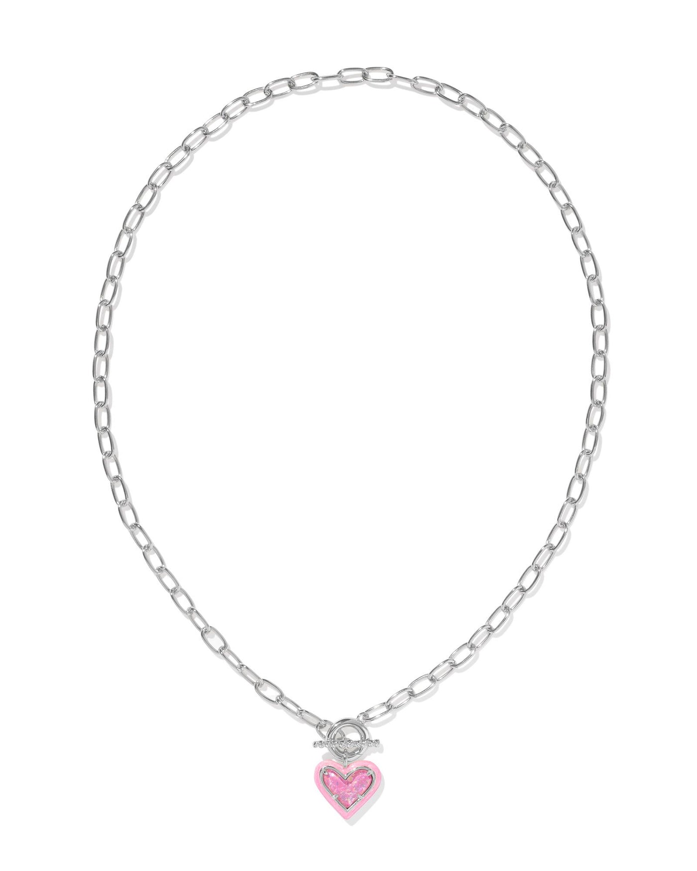 Silver link chain necklace with pink enamel framed pink iridescent glitter glass heart pendant, full view.