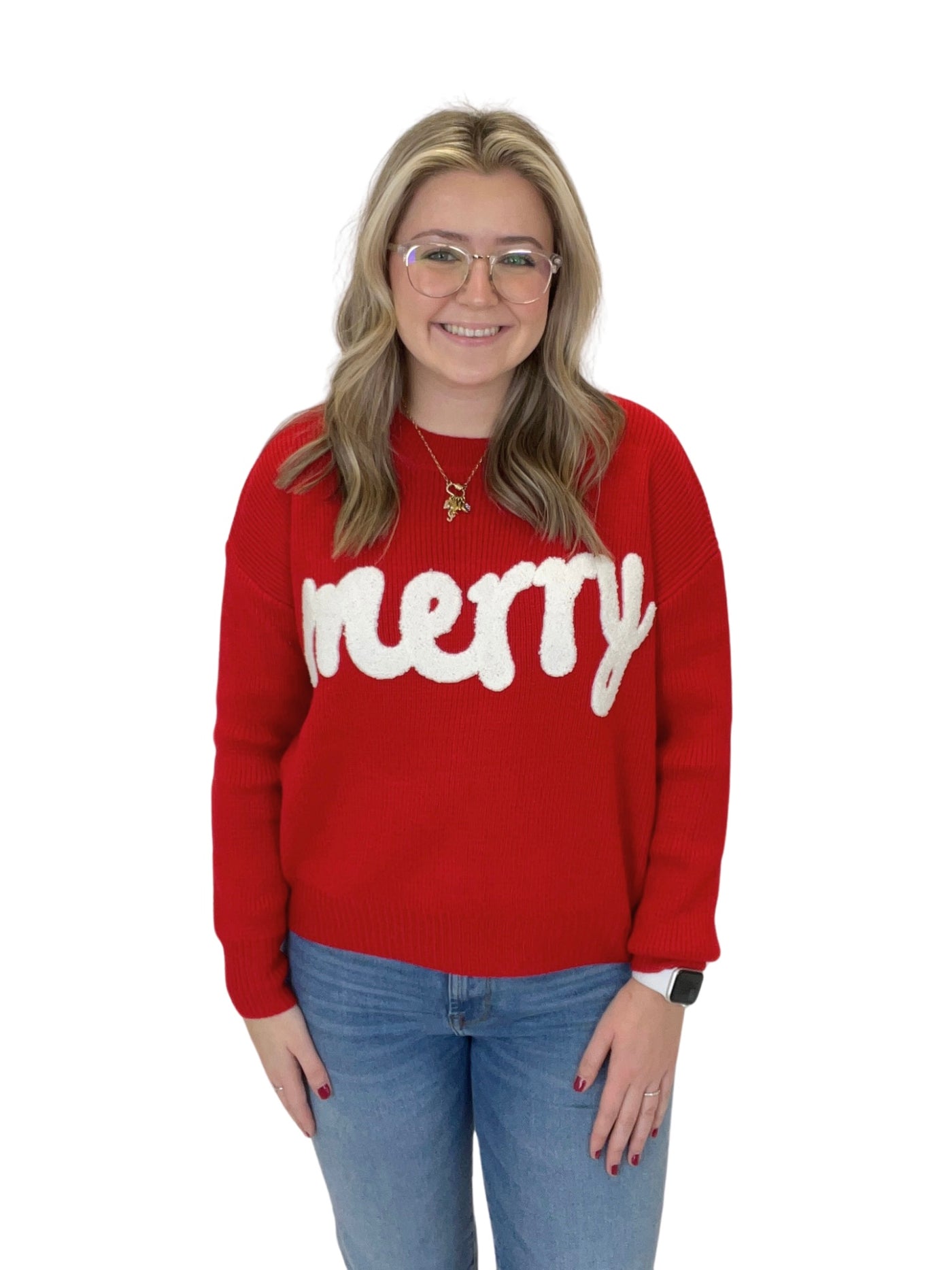 Red "merry" embroidered sweater on model, front view.