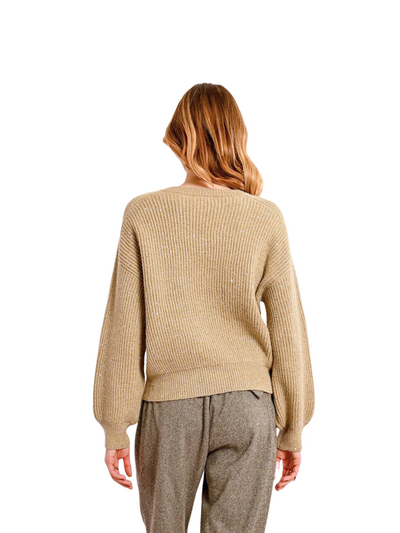 Gold v-neck sequin sweater on model, back view.