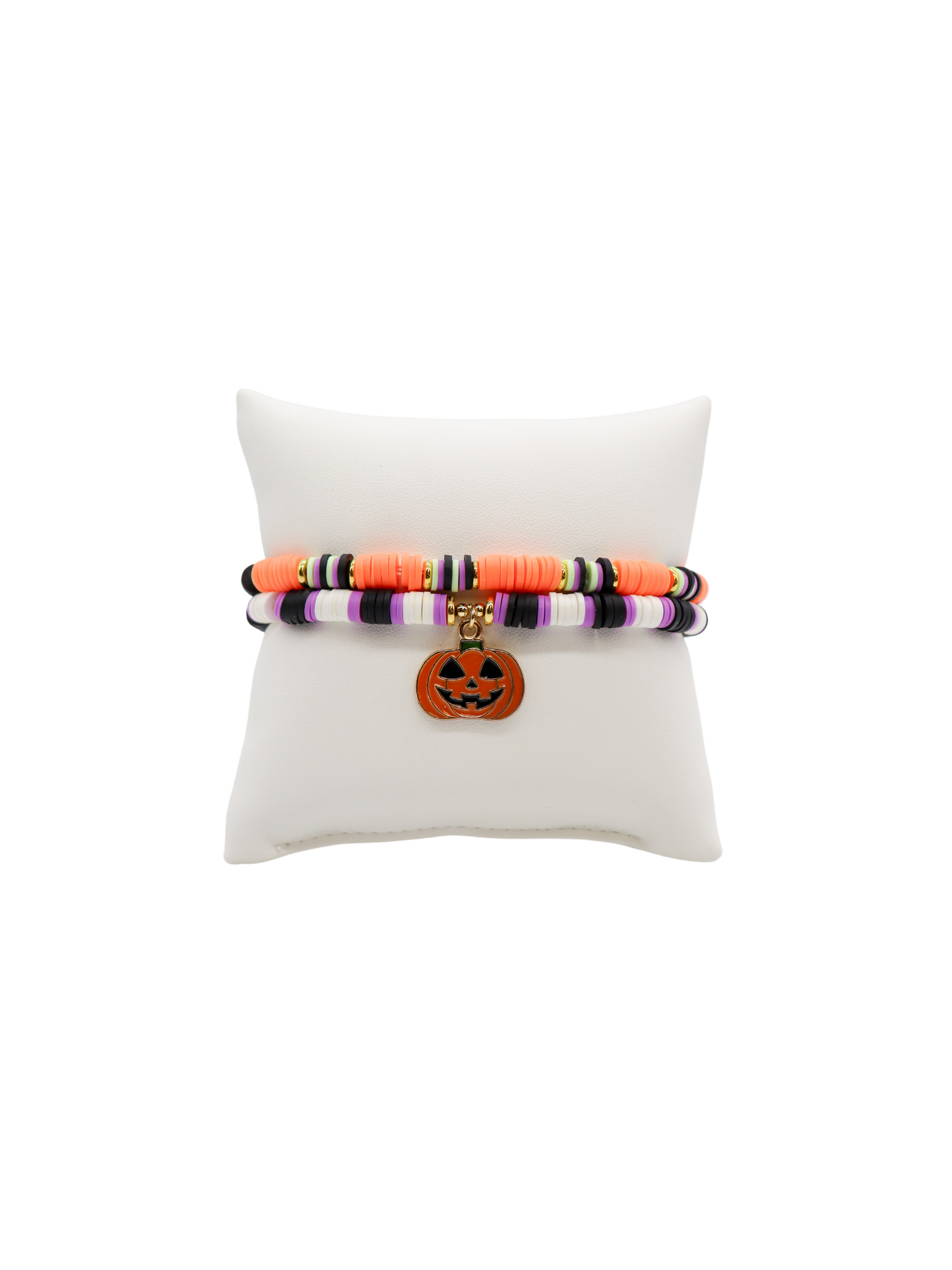 Set of 2 heishi bracelets in orange/multi stripe and black, purple, and white stripe with gold beaded accents and jack o' lantern charm.