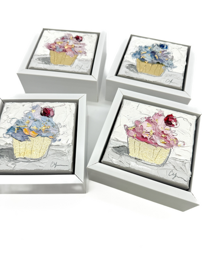 4 cupcake paintings in a collage, angled.