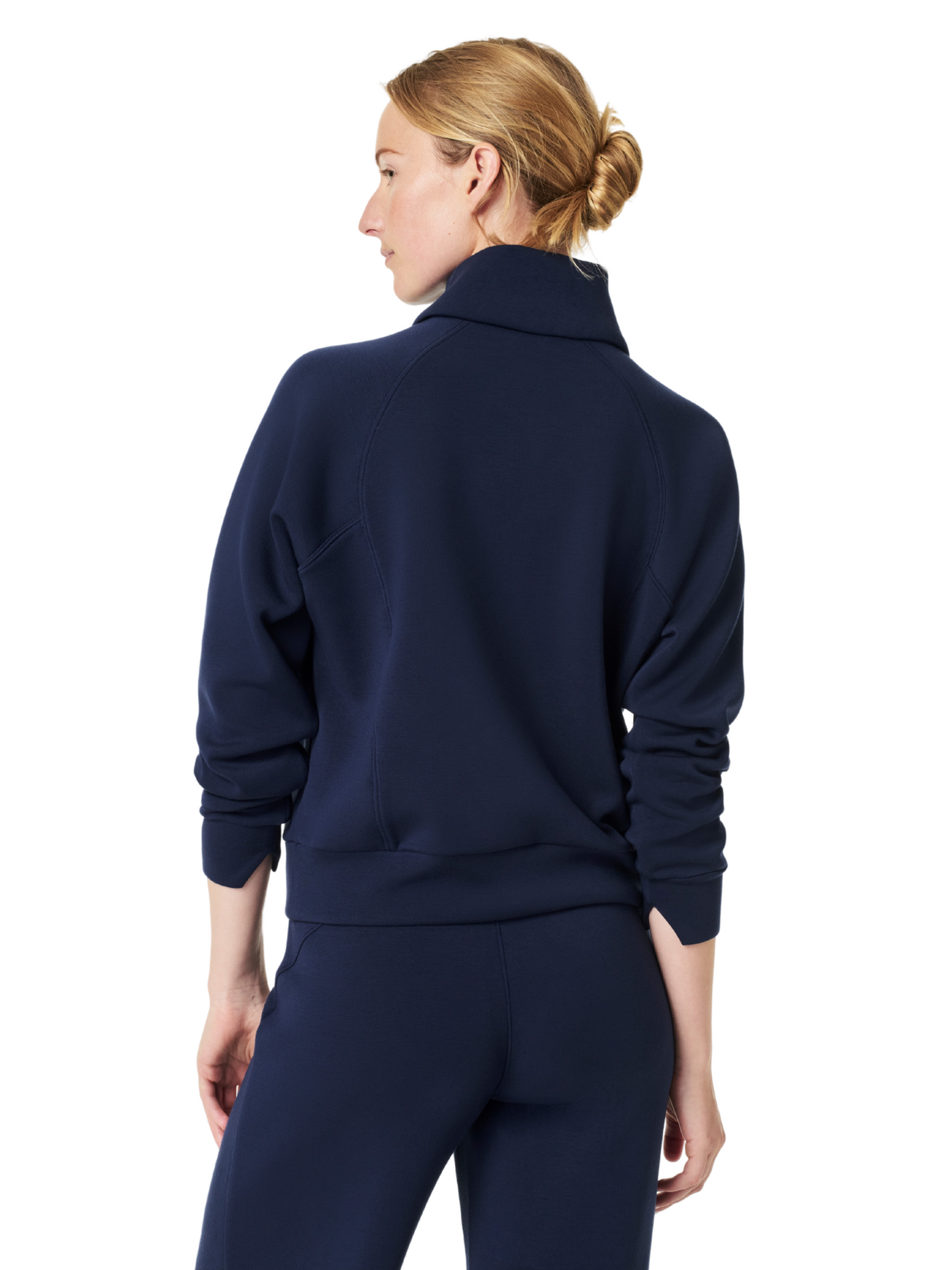 Spanx navy air essentials half-zip on model, closeup, back view.