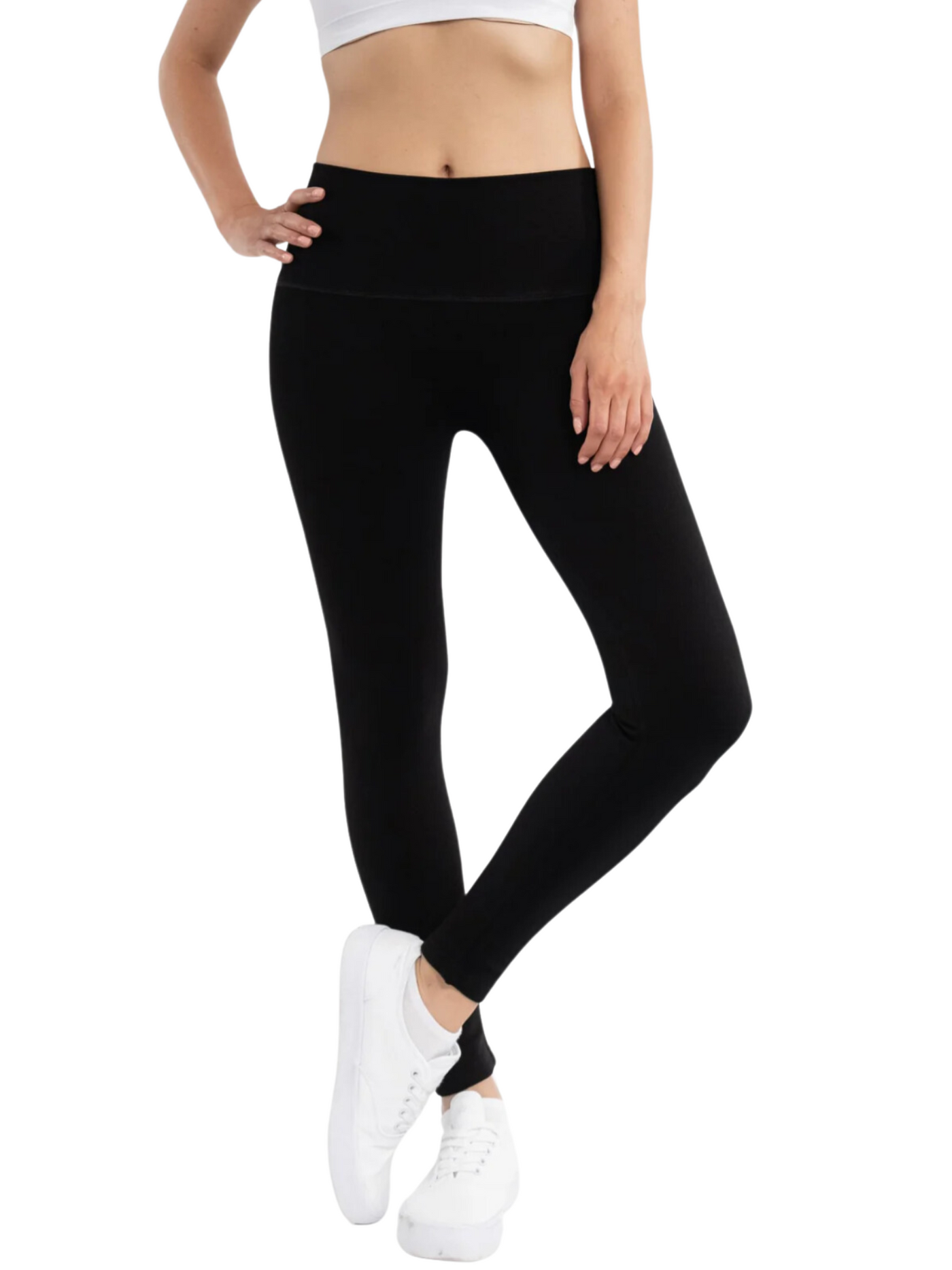 Black fleece lined leggings on model, front view.