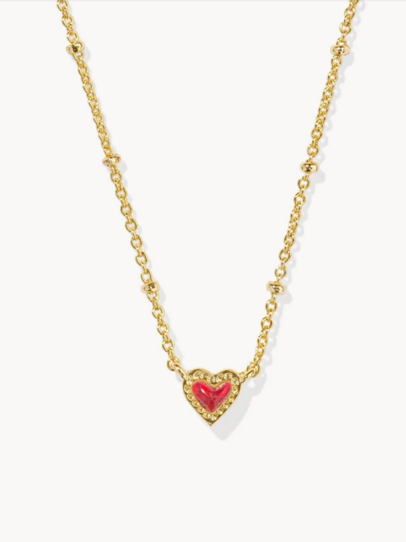 Gold Necklace with Red Kyocera Opal Heart Pendant, closeup.